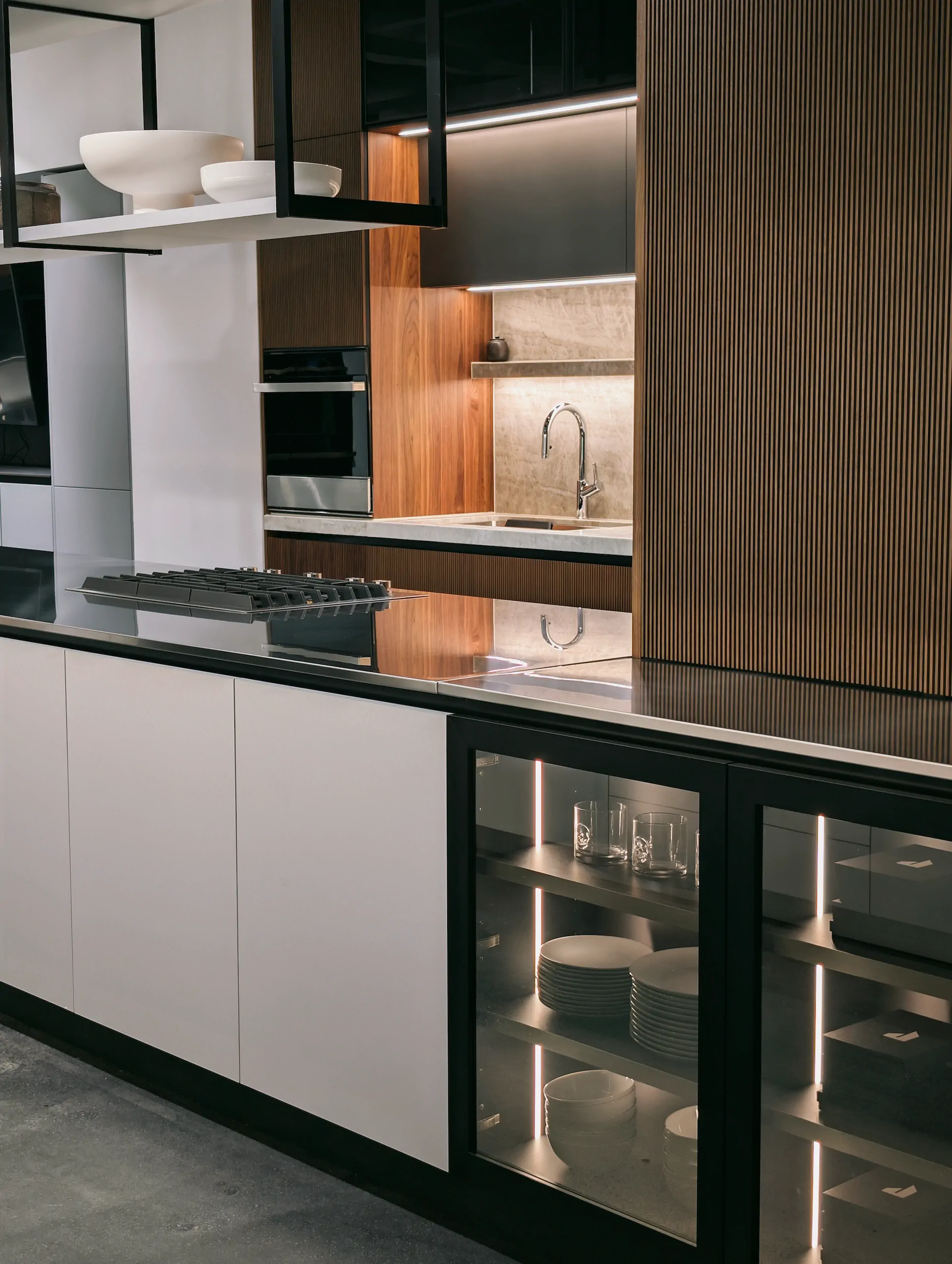 JennAir appliances inside a KI Atelier showroom kitchen with island and appliance wall