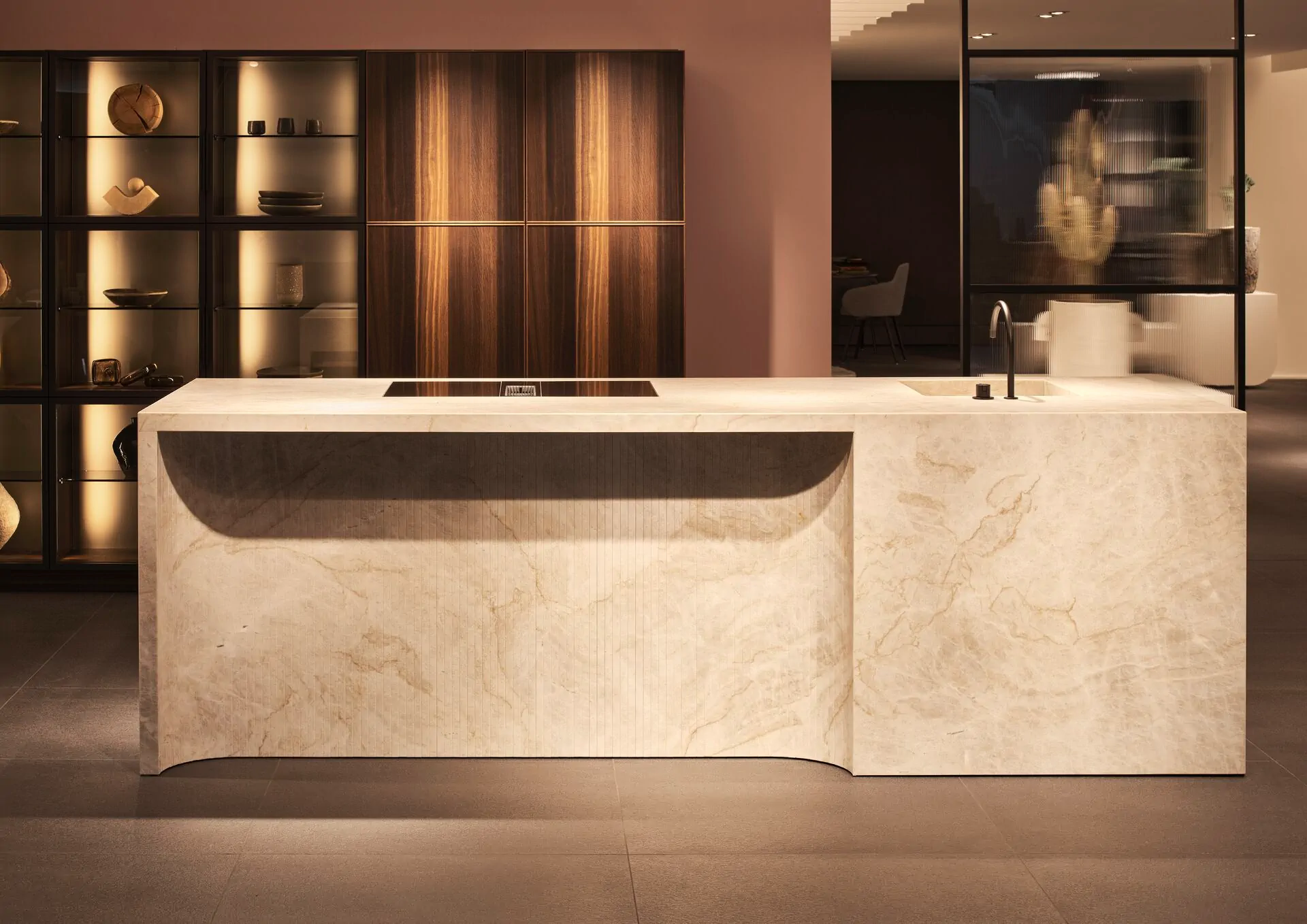 Poggenpohl kitchen with architectural island, integrated cabinetry, warm shelving, and refined material detailing