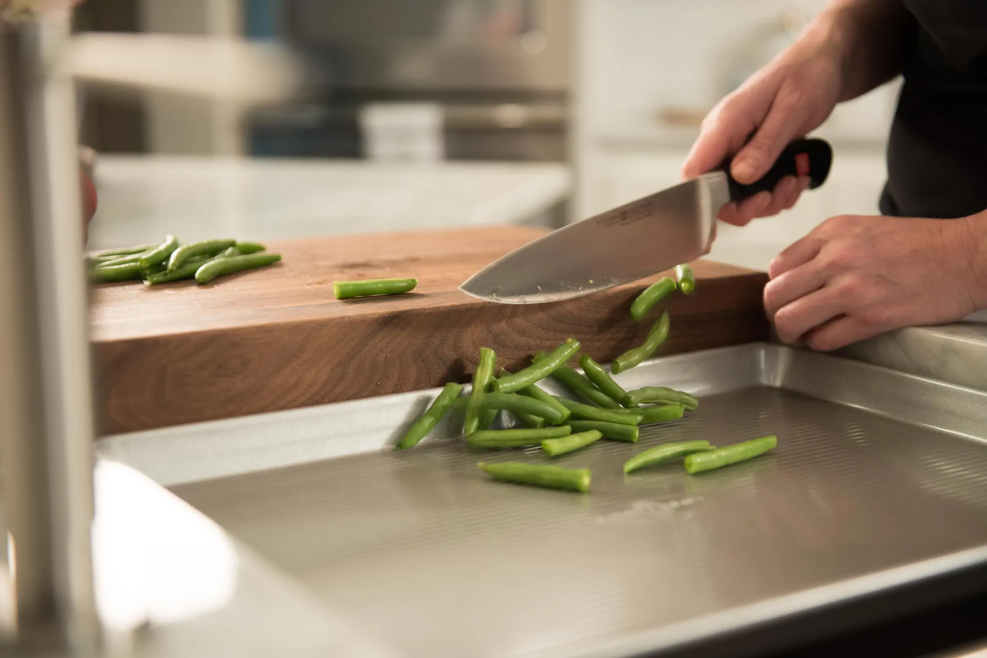 The Galley Workstation arranged for food preparation and serving with bowls, boards, and culinary tools